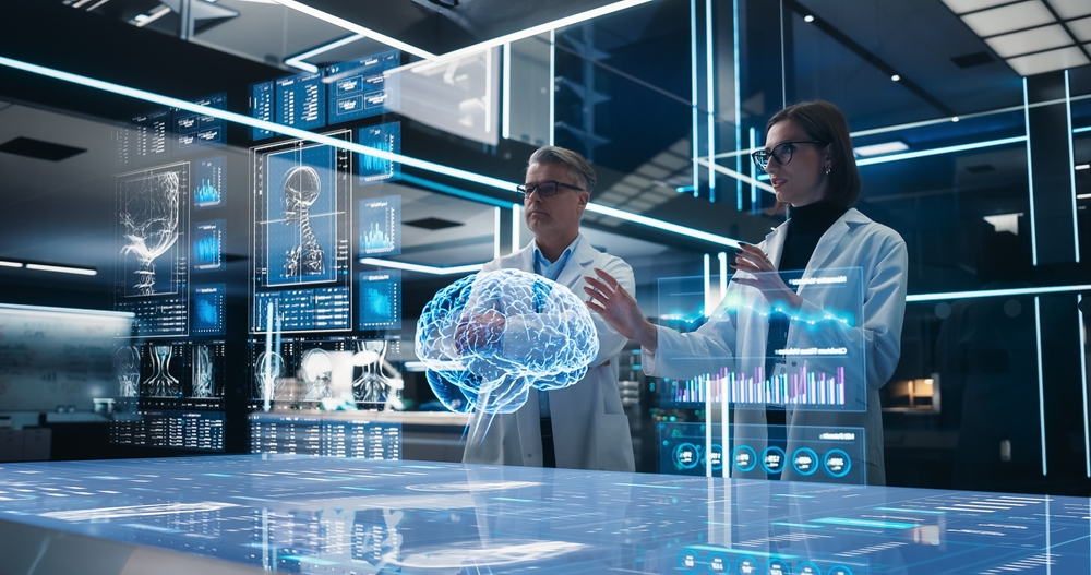 Two neuroscientists analyze a computer-generated digital hologram of the human brain